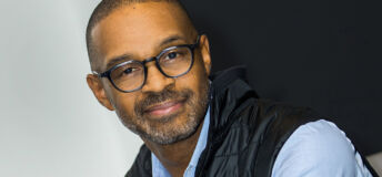 Michael Harris, NYSE, with glasses, light blue shirt and vest